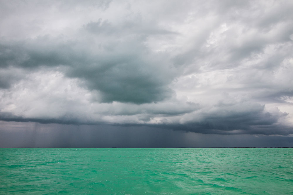 big dark clouds on the horizon bright turquoise sea florida keys
